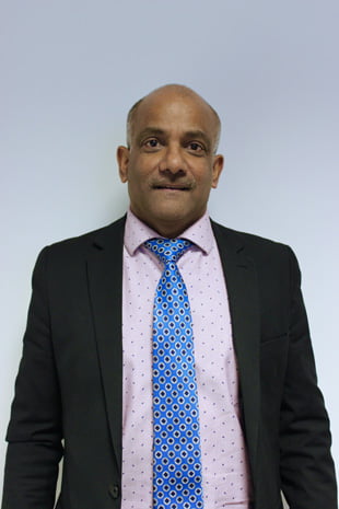 Ben Veerapen, the accomplished Managing Partner at Exchange Legal Services, and a qualified Solicitor of England and Wales, portrayed in a professional setting.